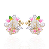A pair of silver gold plated earrings with pearls, shell flowers and a pink butterfly charm.
